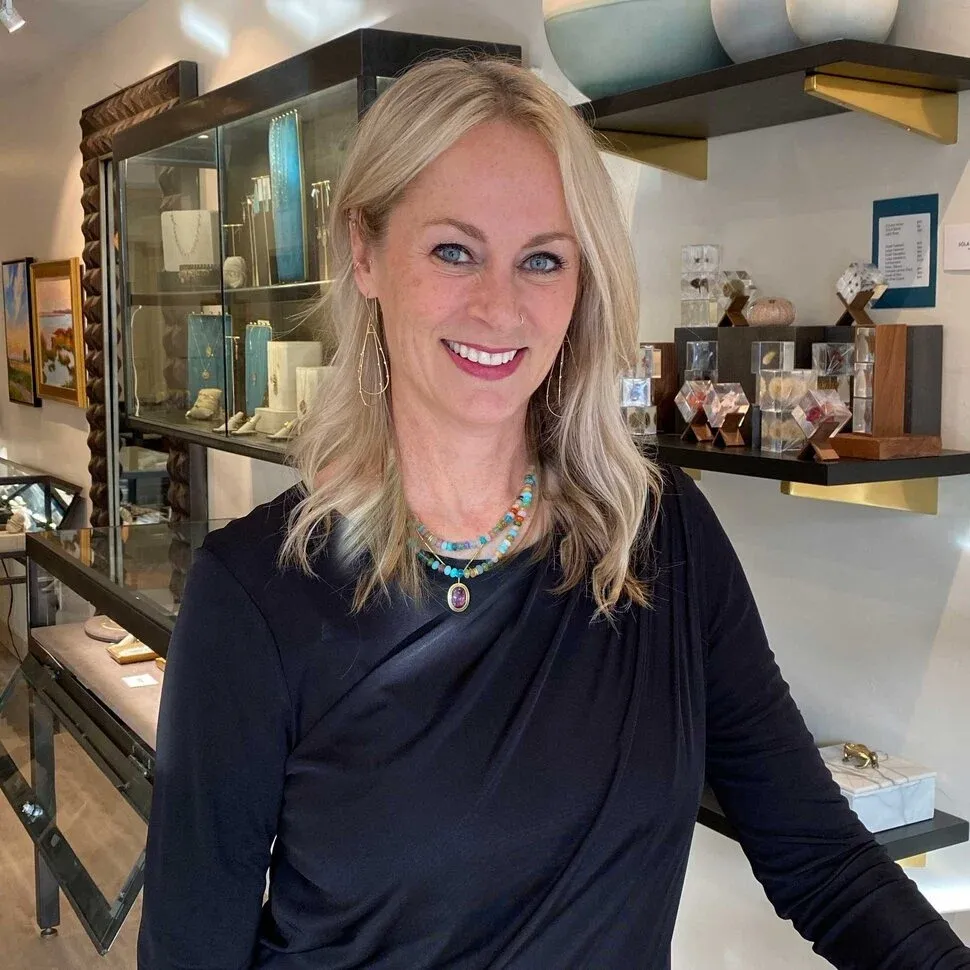 Jewelry stylist in store, wearing pieces from the collection