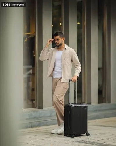 Creator wearing a tan Samsonite backpack outdoors