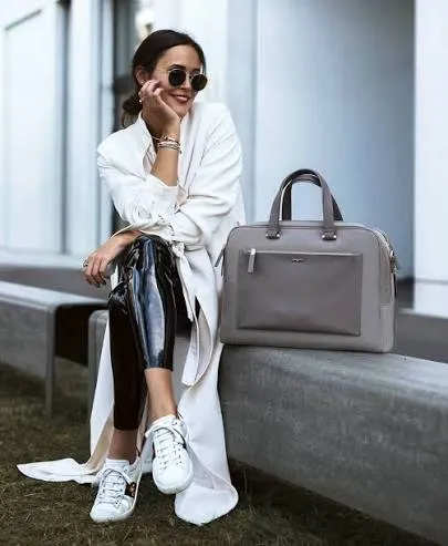Creator styled with a grey Samsonite business bag